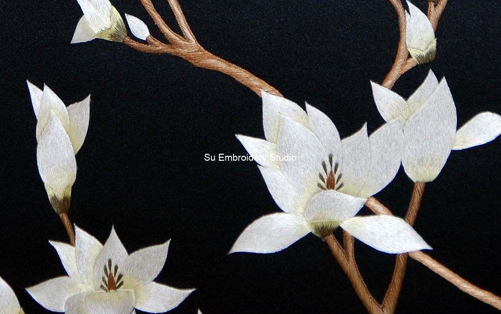 closeup of white magnolia silk embroidery