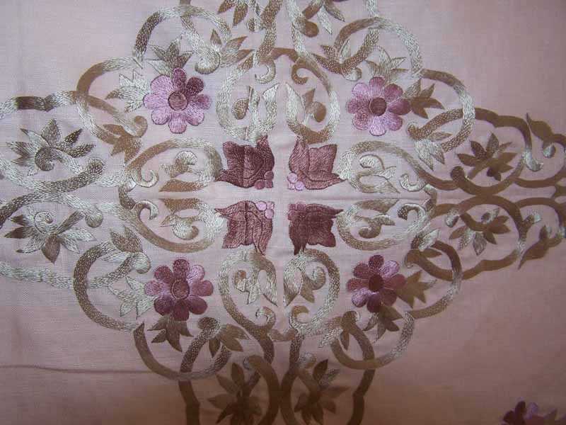 closeup of silk embroidery on linen fabric