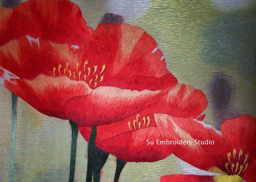 closeup of silk embroidery 'red poppies'