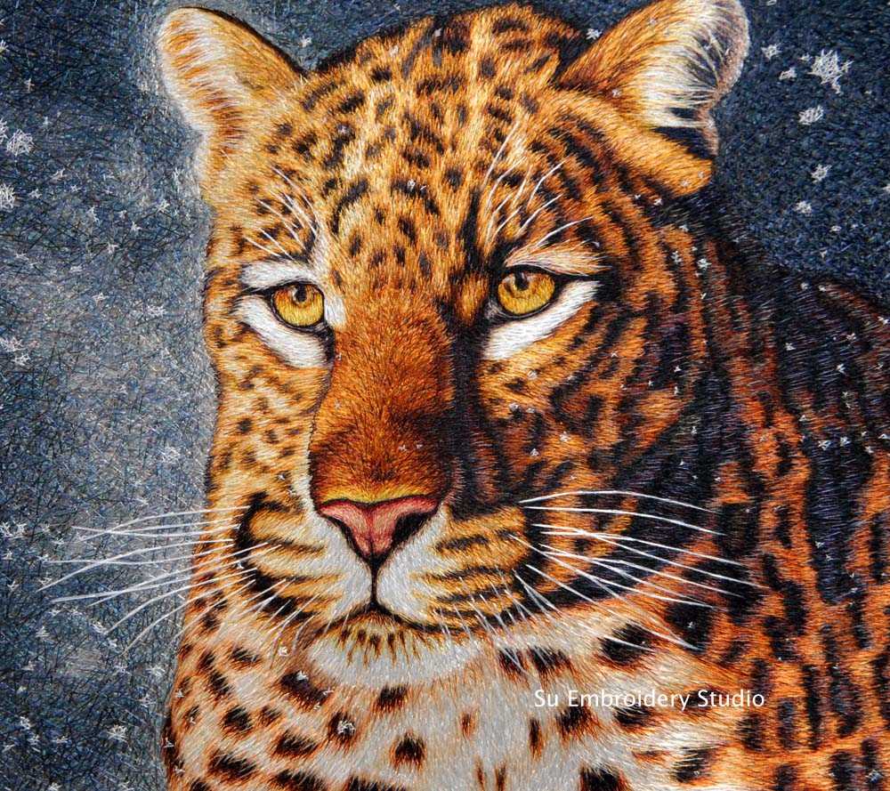close up of hand embroidered silk 'running leopard'